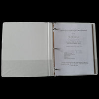 3-ring binder open to cover page.